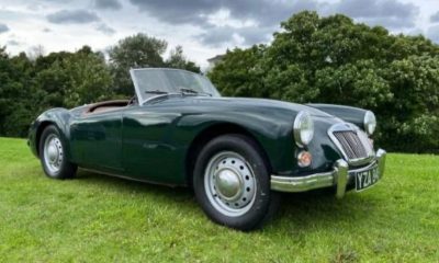 Classic MGA Roadster parked on green grass under cloudy sky