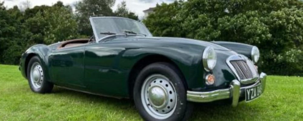 Classic MGA Roadster parked on green grass under cloudy sky