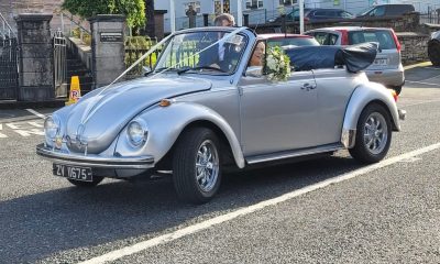 Silver Volkswagen Beetle Karmann Cabriolet with flowers